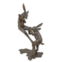 Picture An original sculpture of two boxing hares made of bronze