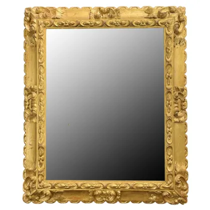 Picture A chic carved mirror in a gold frame from the 19th century