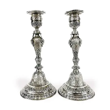 Picture A unique pair of Swiss silver candlesticks with Indian decorations