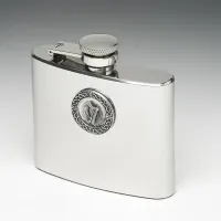 Picture A stylish hip flask with a tin disc decorated with a harp motif