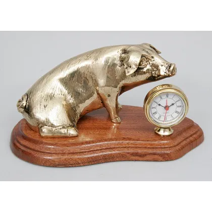 Picture An intriguing bronze clock with a pig