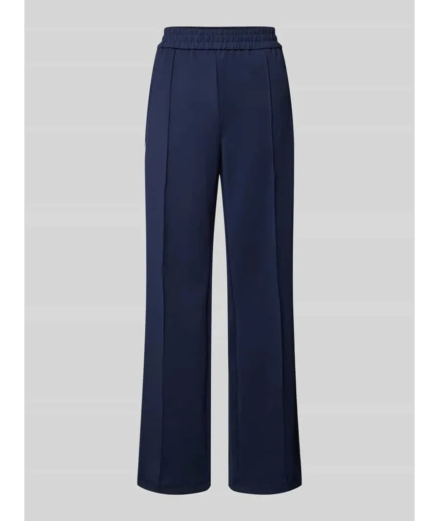 obrazek 1 Spodnie typu track pants o luźnym kroju z paskami w kontrastowym kolorze model ‘WARM UP X’