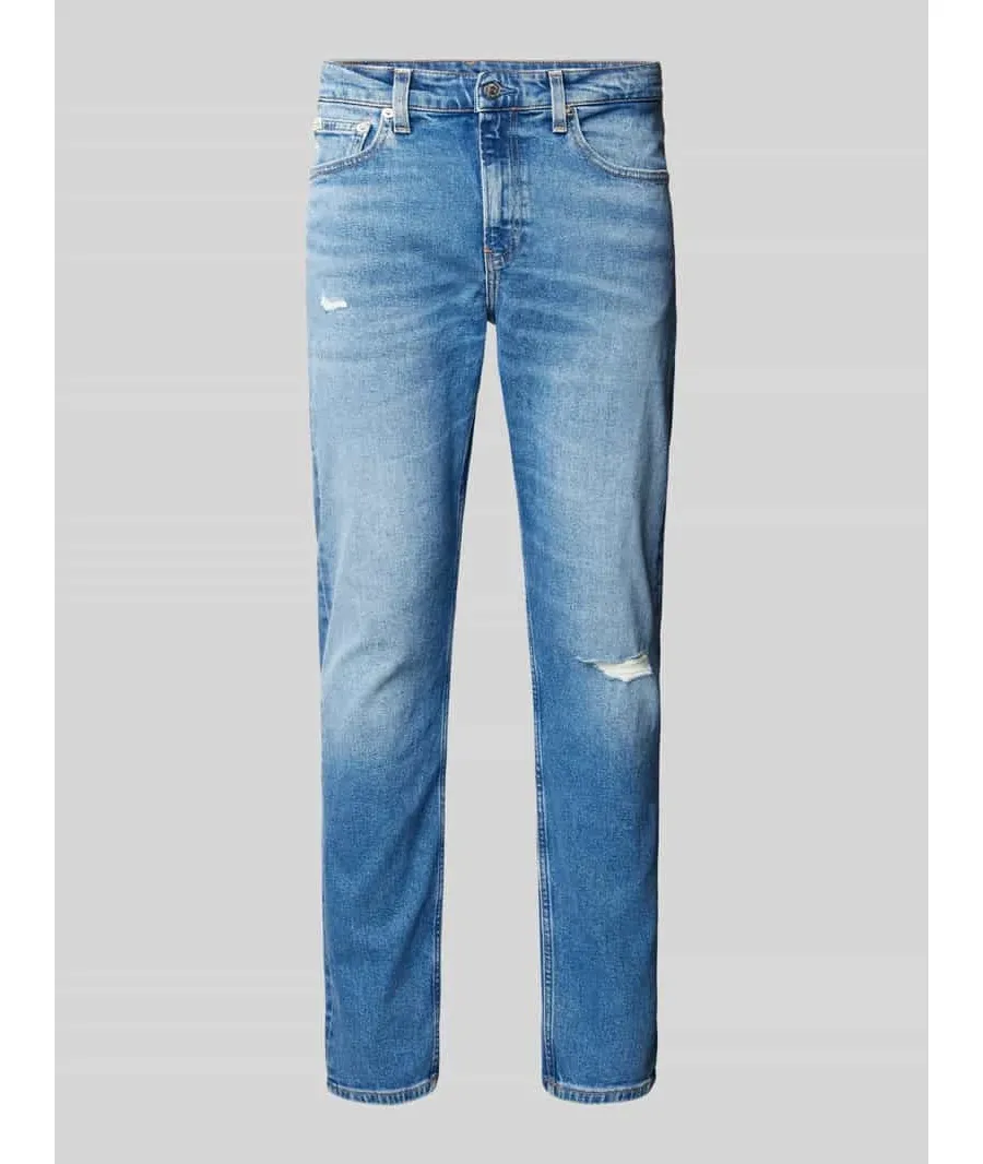 obrazek 1 Jeansy o kroju slim tapered fit z przetarciami