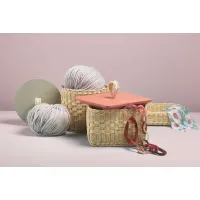 Picture Cylindrical wicker container with wooden or leather lid and woven handle