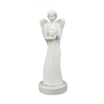 Picture A stylish sculpture depicting an angel holding a heart