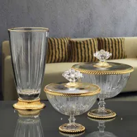 Picture Unique containers and a crystal vase with gold decorations