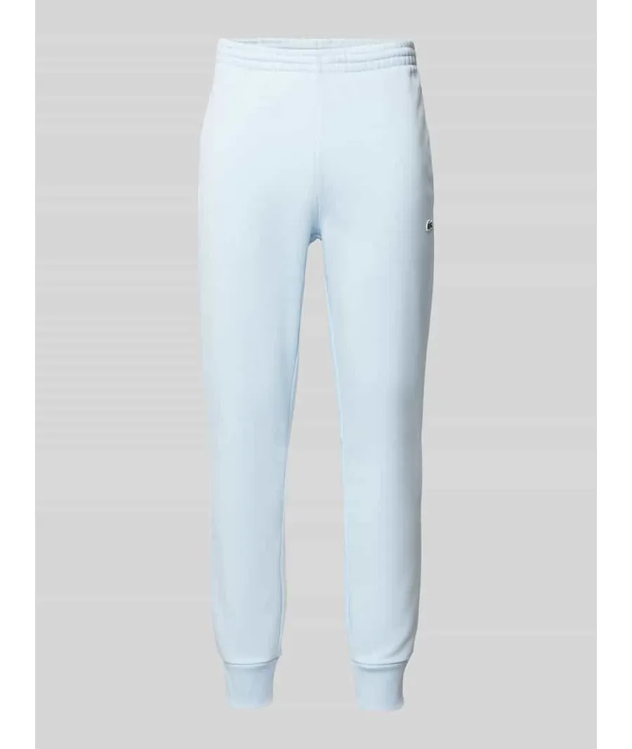 obrazek 1 Spodnie dresowe o kroju slim fit z naszywką z logo
